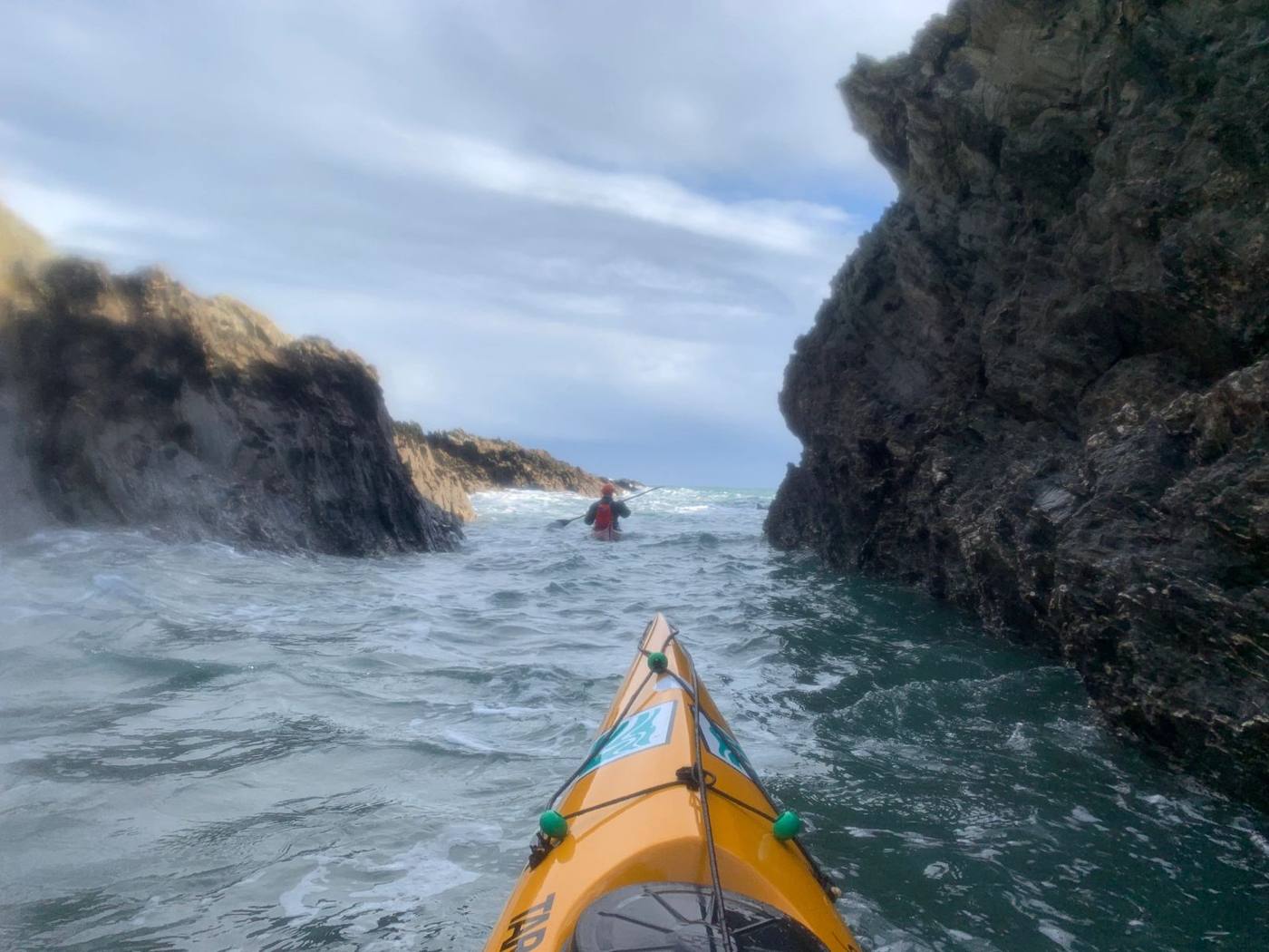 Kayaking through rocky outcrops filled with confused water. Photo: Jeff Allen